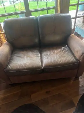 Leather love seat and chair with footstool