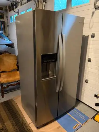 Side by Side Stainless Whirlpool Refrigerator w/in door dispenser