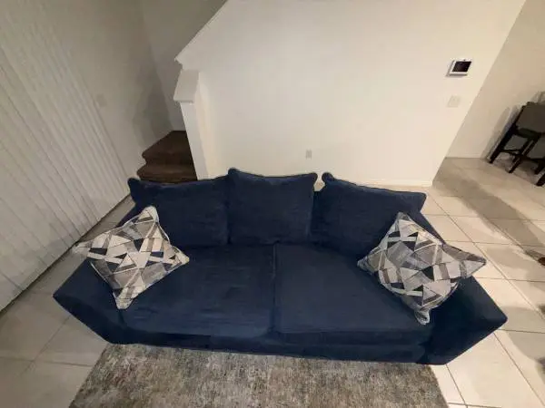 Blue Couch w/ Decorative Pillows