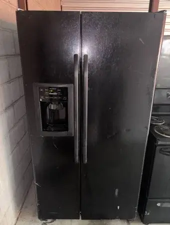 Black GE Refrigerator And Freezer