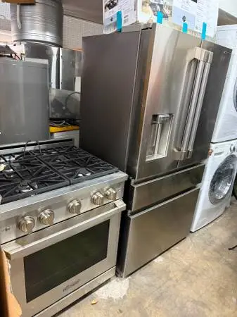 Dacor refrigerator and slide in gas range stainless steel