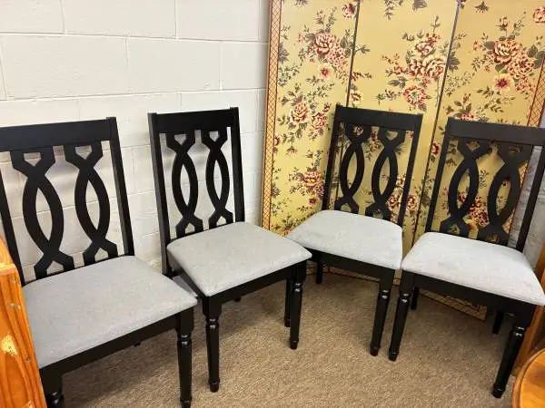 Four (4) Black dining chairs with gray upholstered seats