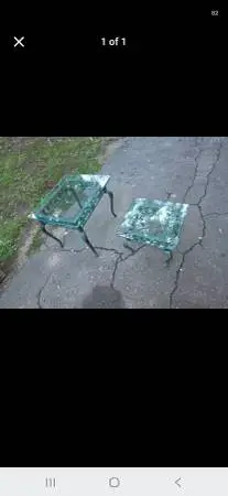 Two decorative glass top end tables