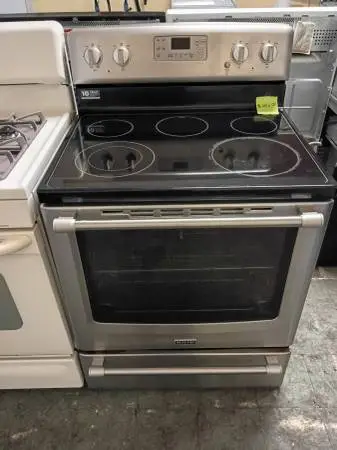 Maytag stainless steel and black electric stove